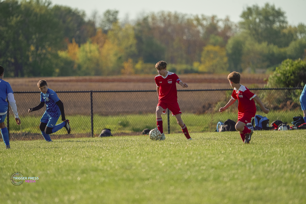 Youth soccer players competing on the field