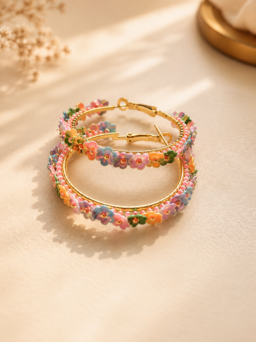 Colourful floral gold hoop earrings by Mooigoed Design