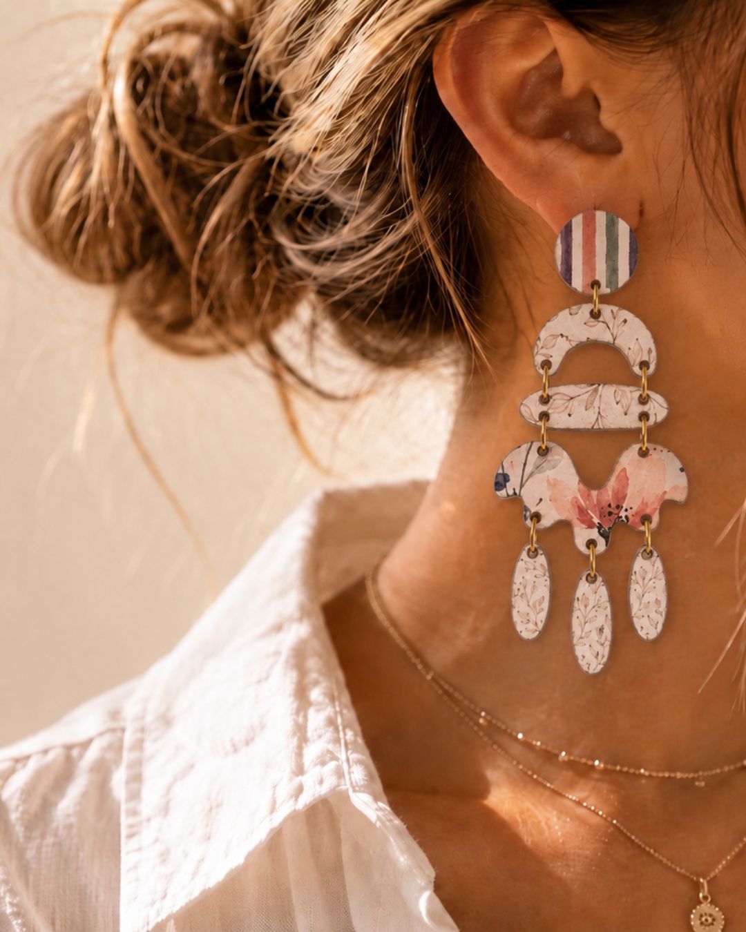 A woman wearing a large Mooigoed Design statement earring