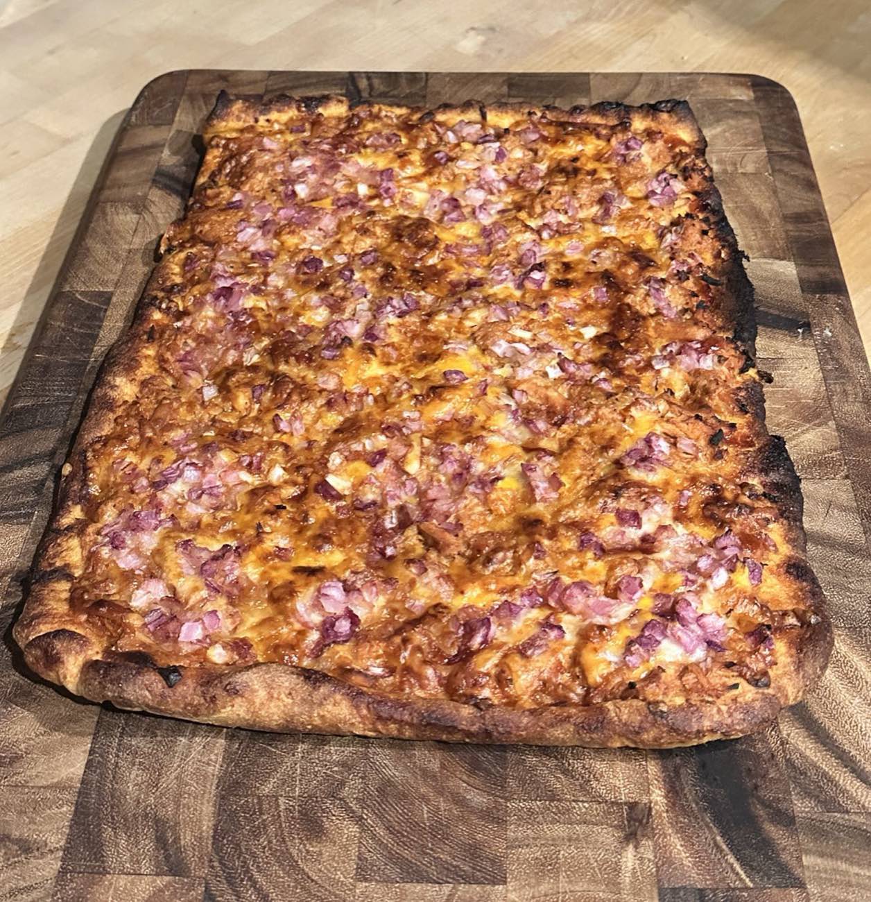 Homemade pizza fresh off the board