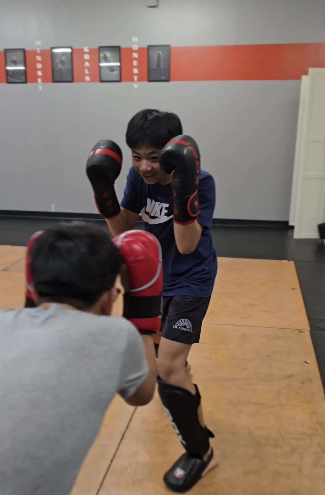 Teen student sparring in gloves in a youth martial arts class in Richmond BC