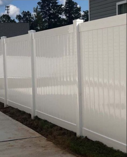 White vinyl privacy fence recently installed at a Tennessee residential property