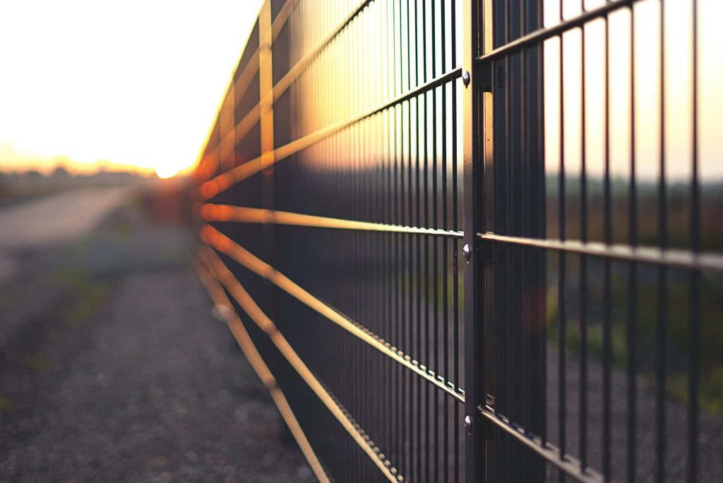Ornamental metal fence at sunset along a residential property in East Tennessee