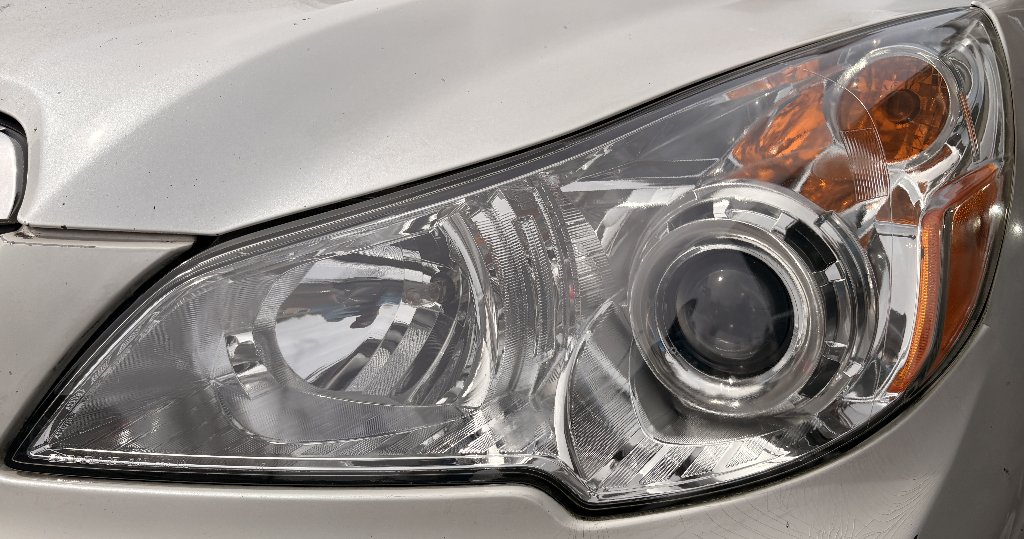 Subaru Outback headlight restored clear after oxidation removal in Portland Oregon