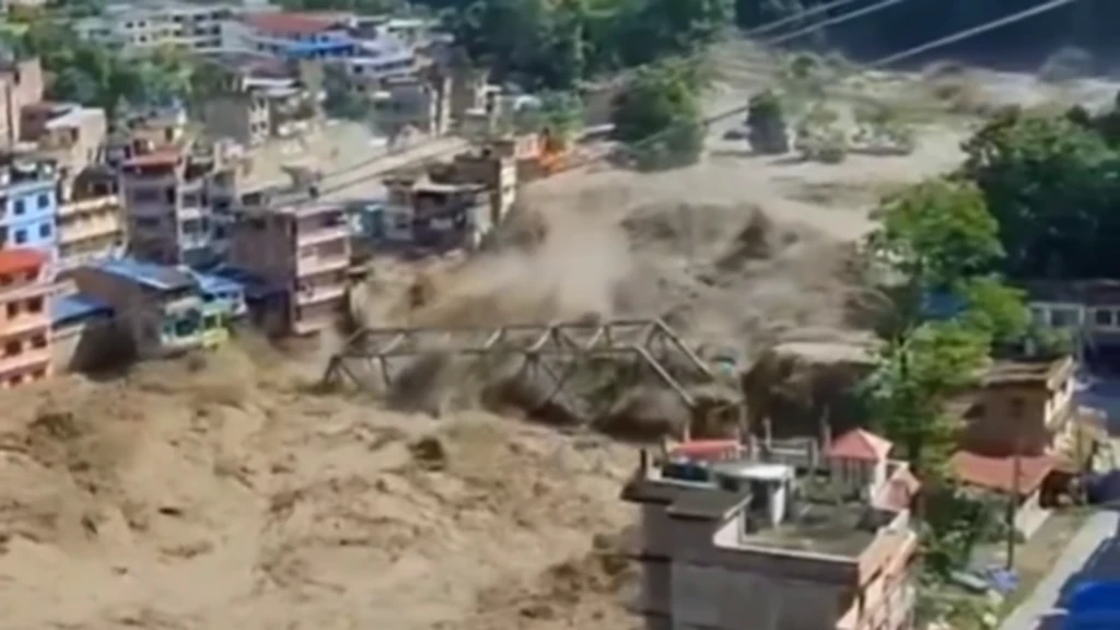 Flash flood crashing through a bridge in Nepal