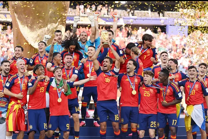 Rodri of Spain lifts the FIFA World Cup Winner's Trophy