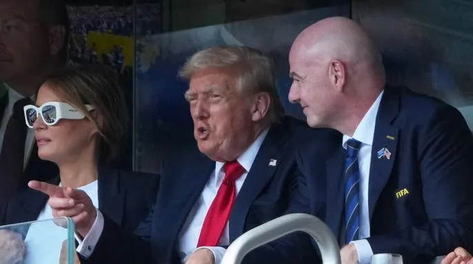 President Donald Trump, First Lady Melania Trump and FIFA President Gianni Infantino in a stadium suite