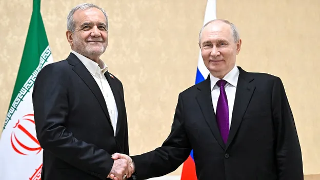 Iranian and Russian officials shake hands