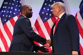 Byron Donalds shakes hands with President Donald Trump