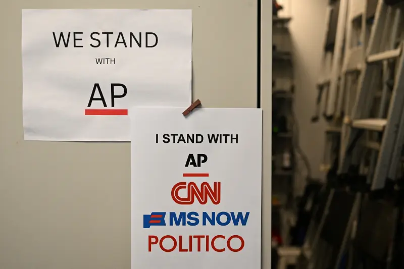 Signs supporting AP, CNN, MS NOW and Politico in the White House briefing room