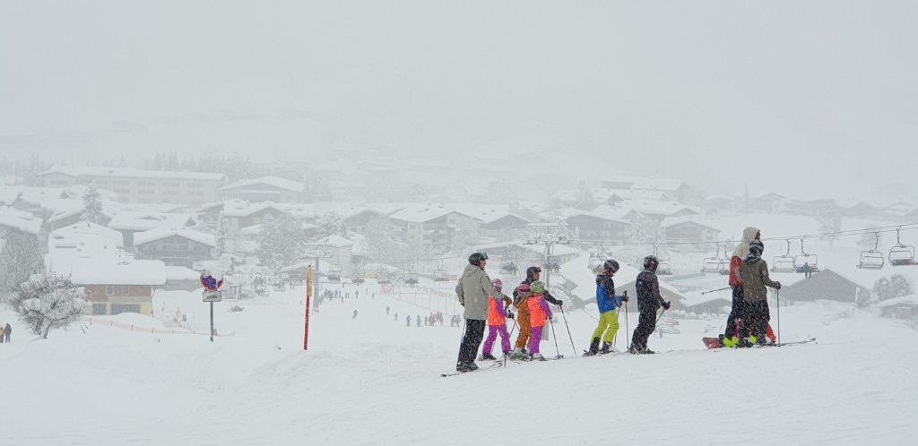 Skiers in heavy snow