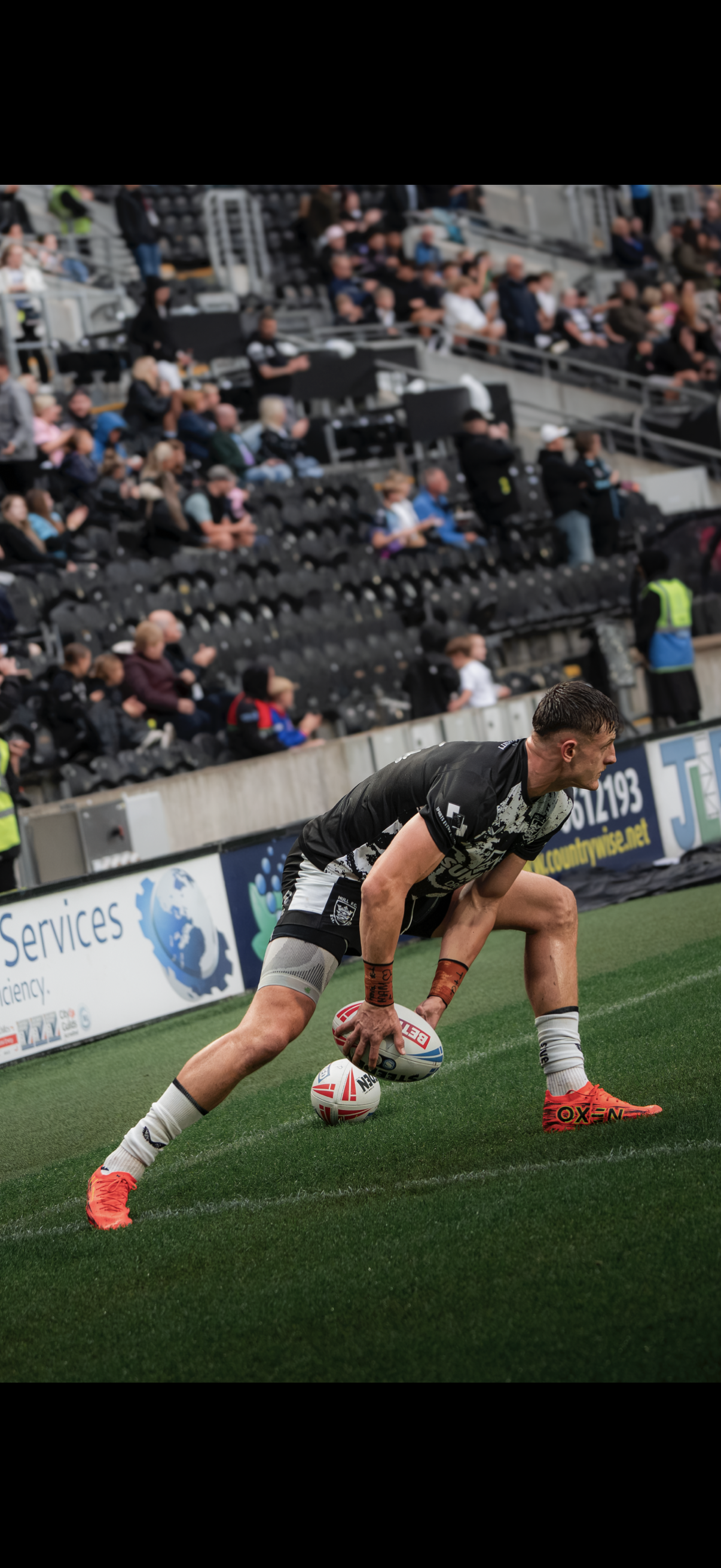 Rugby player placing the ball