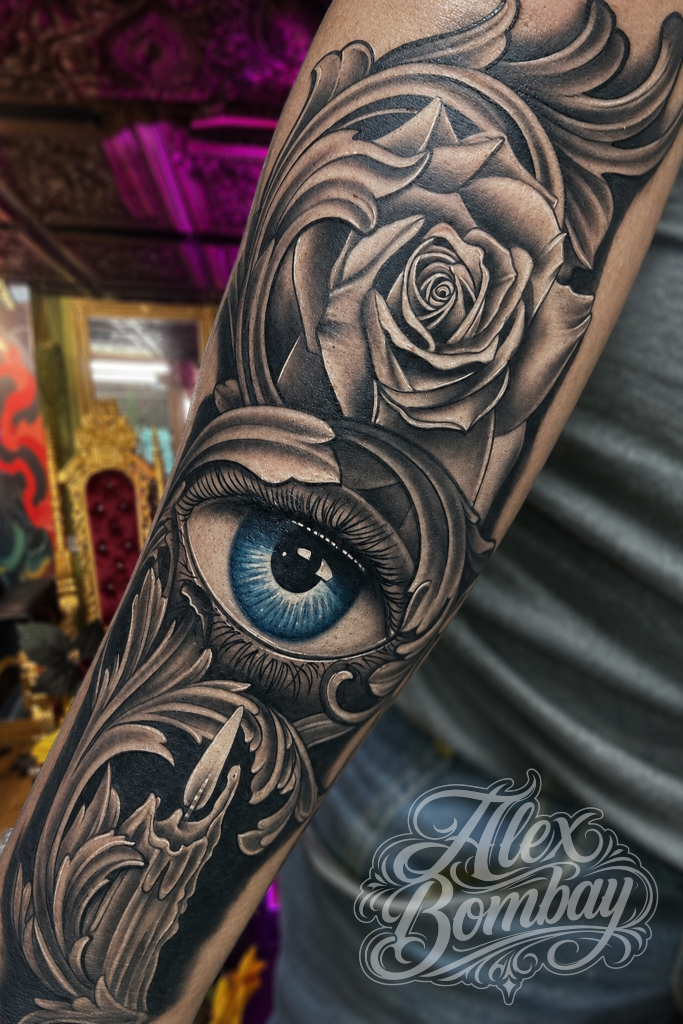 Realistic eyeball black and grey realism sleeve tattoo — Alex Bombay Tattoos Athlone tattoo shop Ireland — Tattoo Mania Studio | Athlone Tattoo Studio — Best Tattoos in Ireland