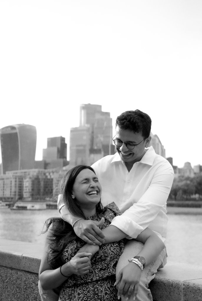 Black and white portrait of couple laughing together