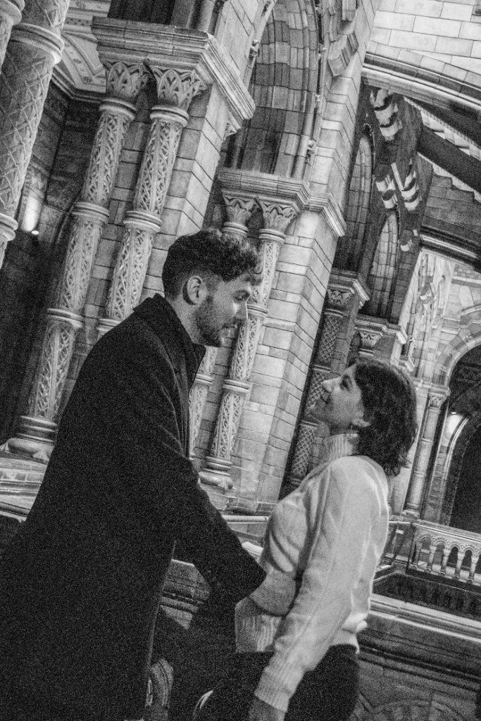 Couple close together black and white Natural History Museum