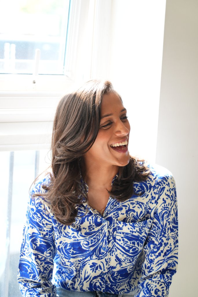 Portrait laughing in blue patterned shirt