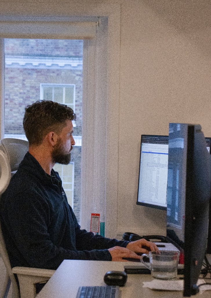 Professional at desk with computer
