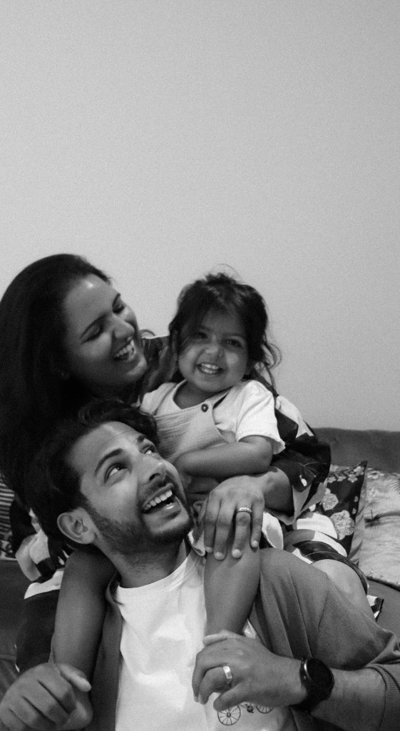 Black and white family portrait laughing together