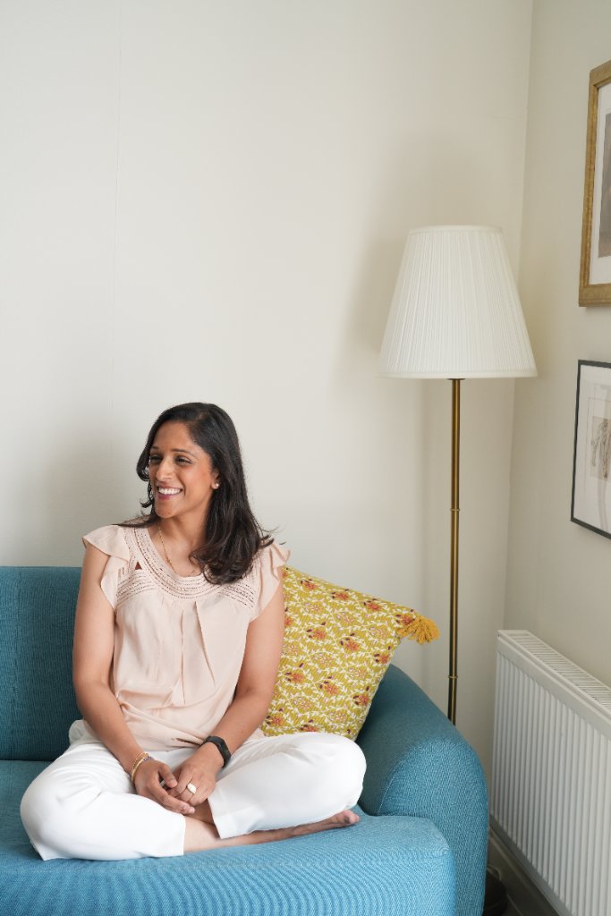 Portrait on teal sofa with lamp