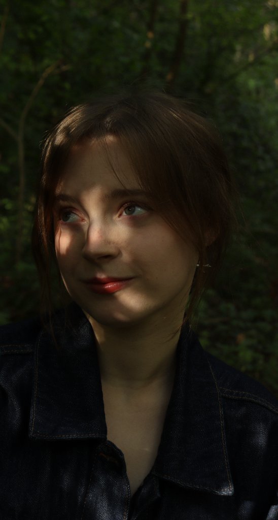 Close-up portrait with nature backdrop