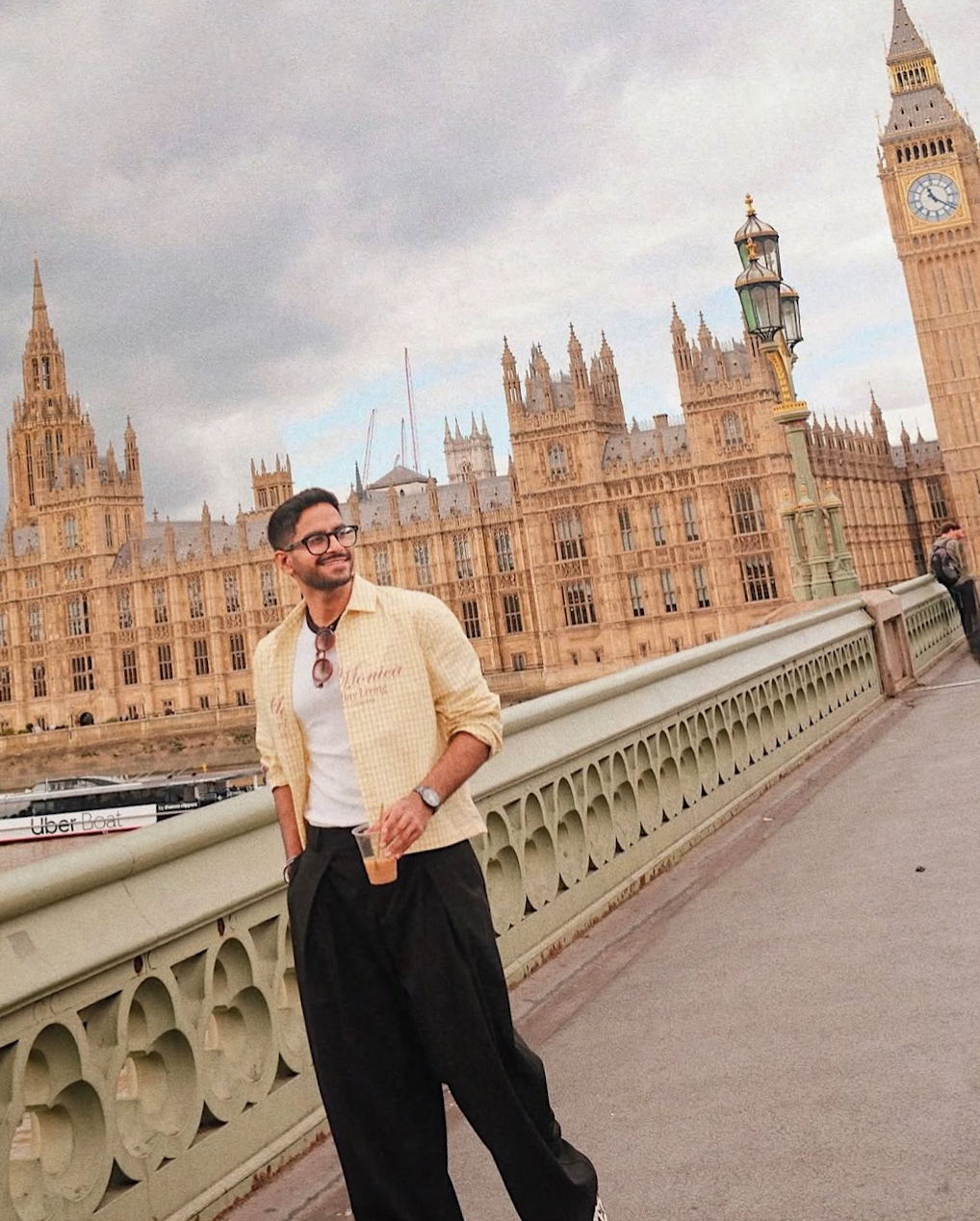 Full body portrait of man on Westminster Bridge with Big Ben