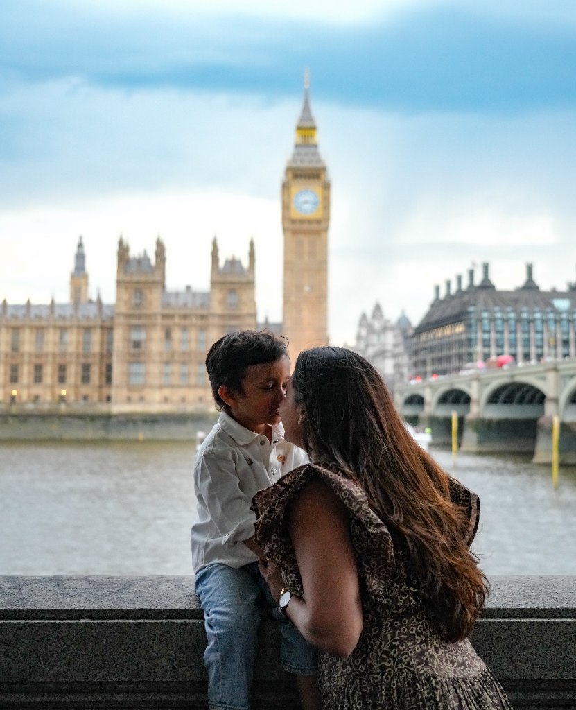 Mother and son sharing affectionate moment by Thames