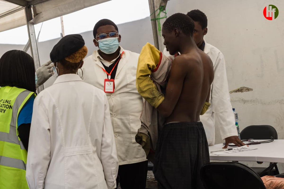 A clinical scene inside the outreach tent