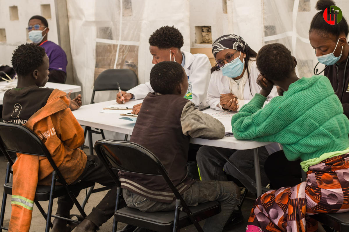 Clinicians conducting consultations at the temporary health station