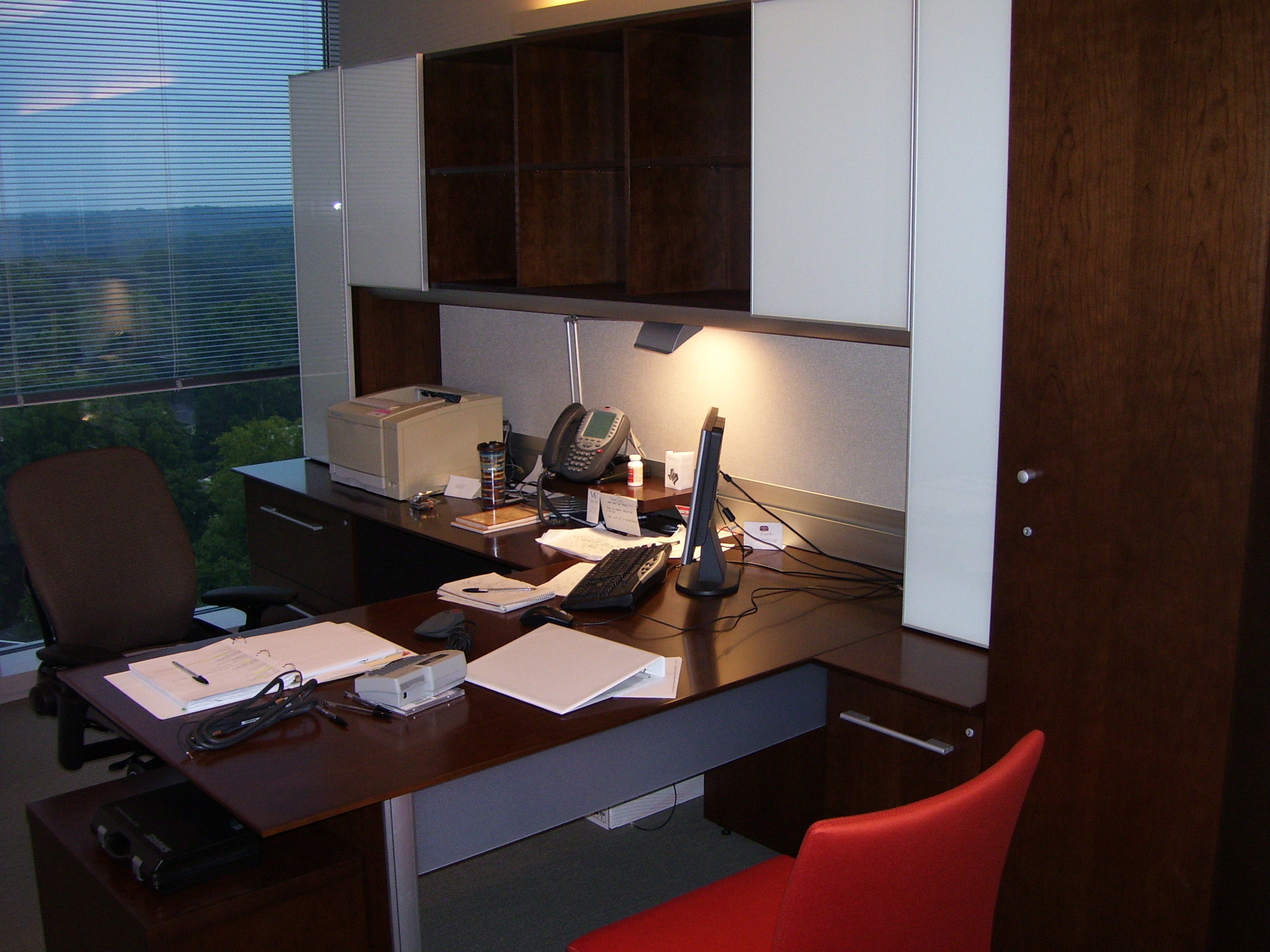 Invesco HQ integration proof, reception, executive corner offices with Atlanta skyline views, glass conference rooms, auditorium AV, video conferencing control room, codec farm server racks, and the executive workspace.
