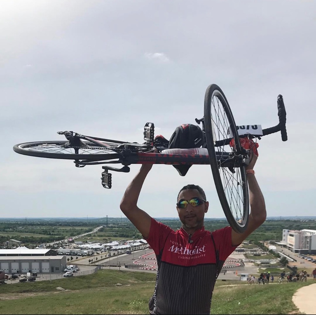 Darrance Tezino lifting his bike after a long-distance ride