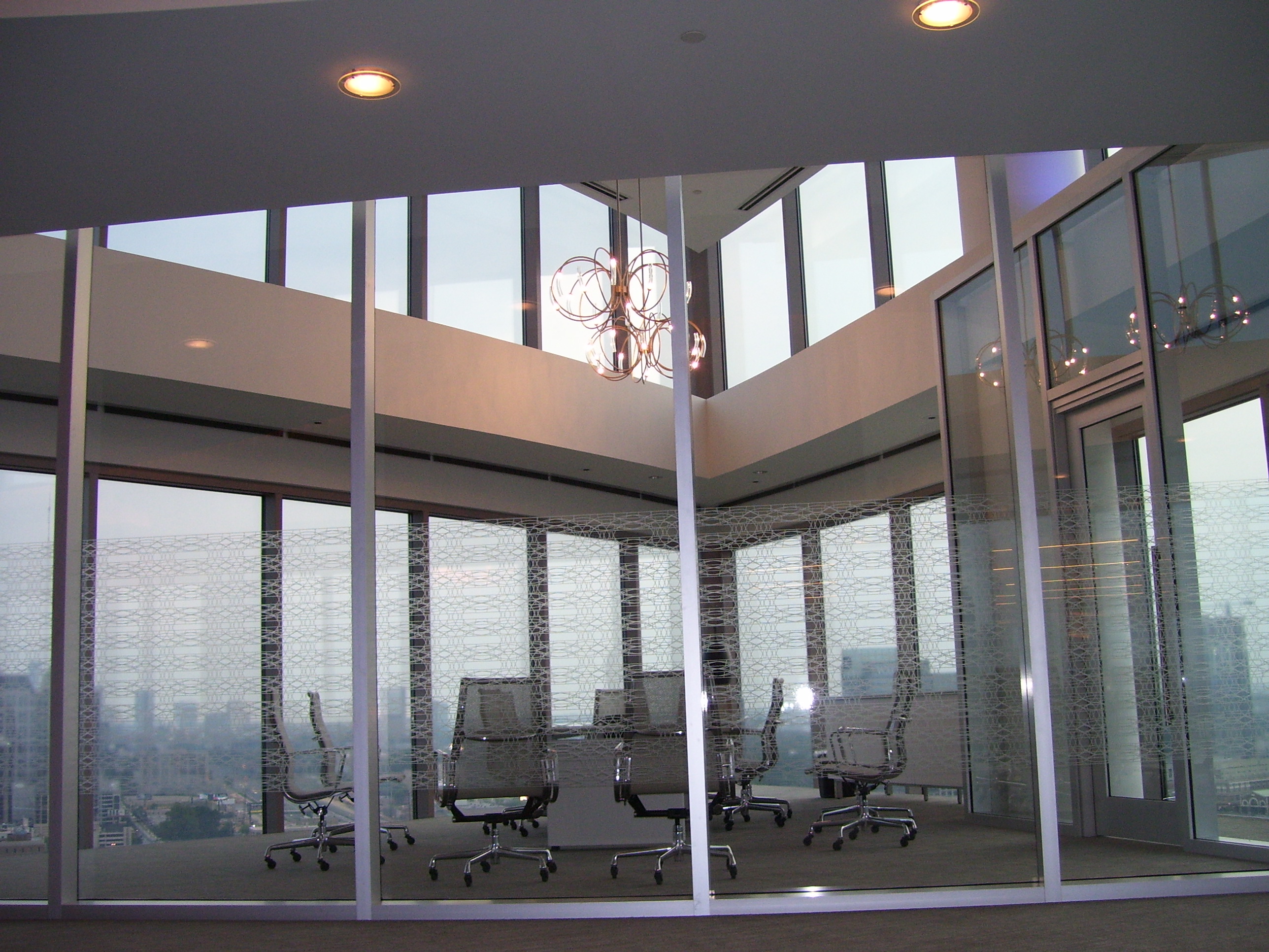 Invesco HQ integration proof, reception, executive corner offices with Atlanta skyline views, glass conference rooms, auditorium AV, video conferencing control room, codec farm server racks, and the executive workspace.