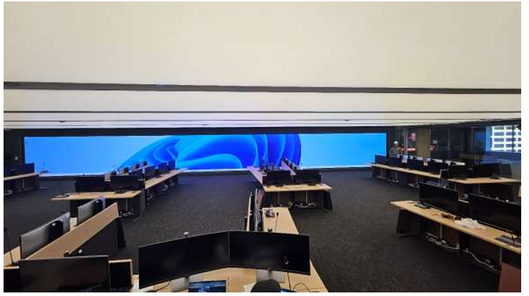 CenterPoint Energy control room build, the US's largest interactive video wall, Cyviz touch-panel controls, U-shaped operator workstations, and 24/7 emergency-operations readiness.