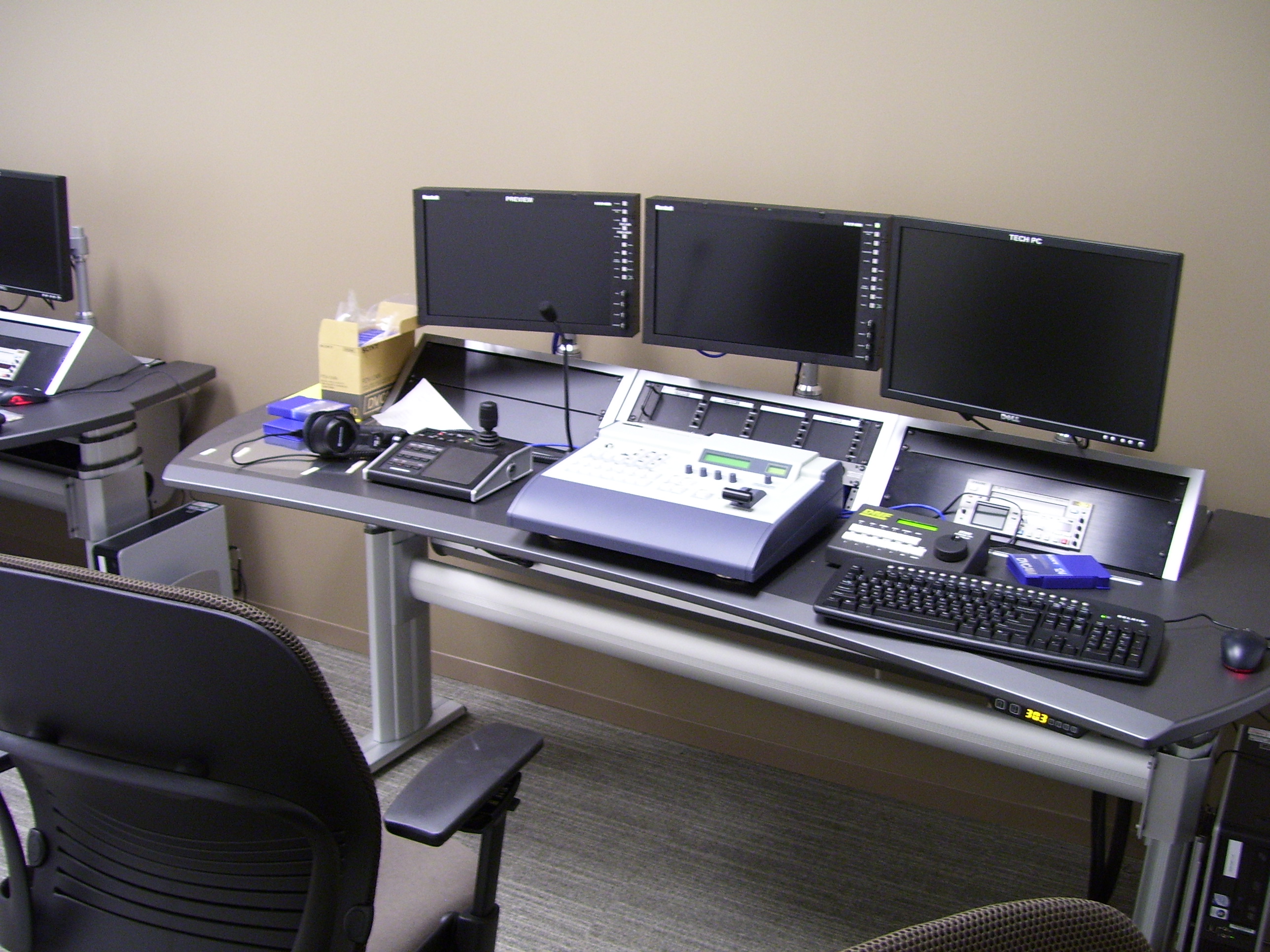 Invesco HQ integration proof, reception, executive corner offices with Atlanta skyline views, glass conference rooms, auditorium AV, video conferencing control room, codec farm server racks, and the executive workspace.