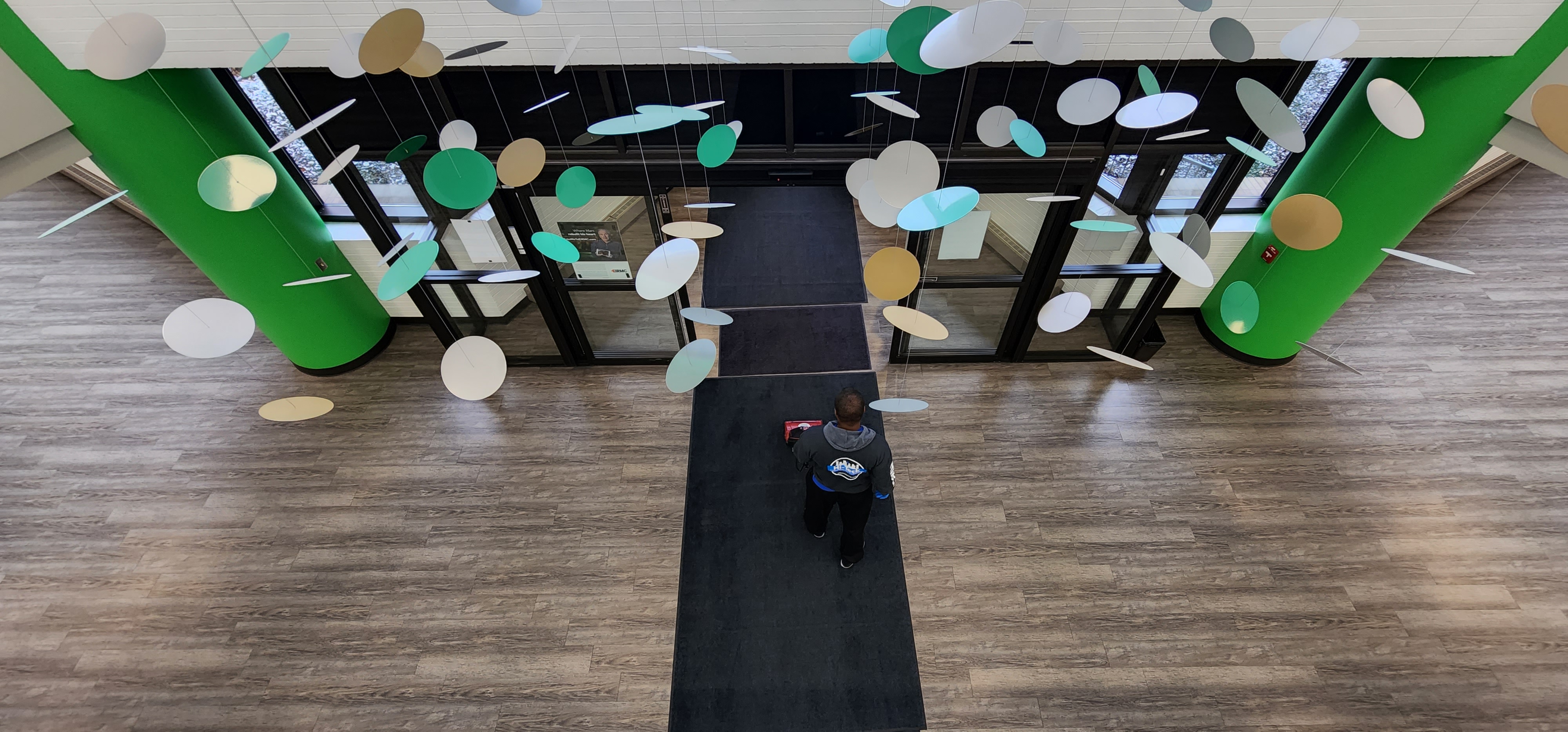 Hi-Teck technician cleaning a medical facility entrance in Idaho Falls