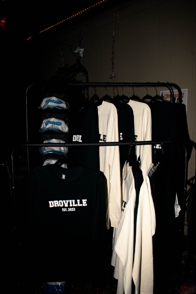Droville merchandise and apparel on display in the vendor village