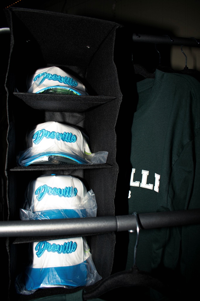 Droville caps and apparel at the merch table
