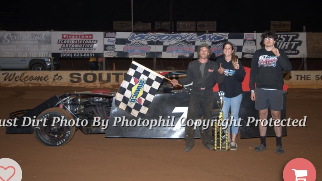 David in Victory Lane with the checkered flag
