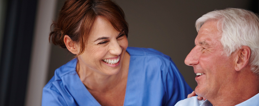 Nurse chatting with an older patient