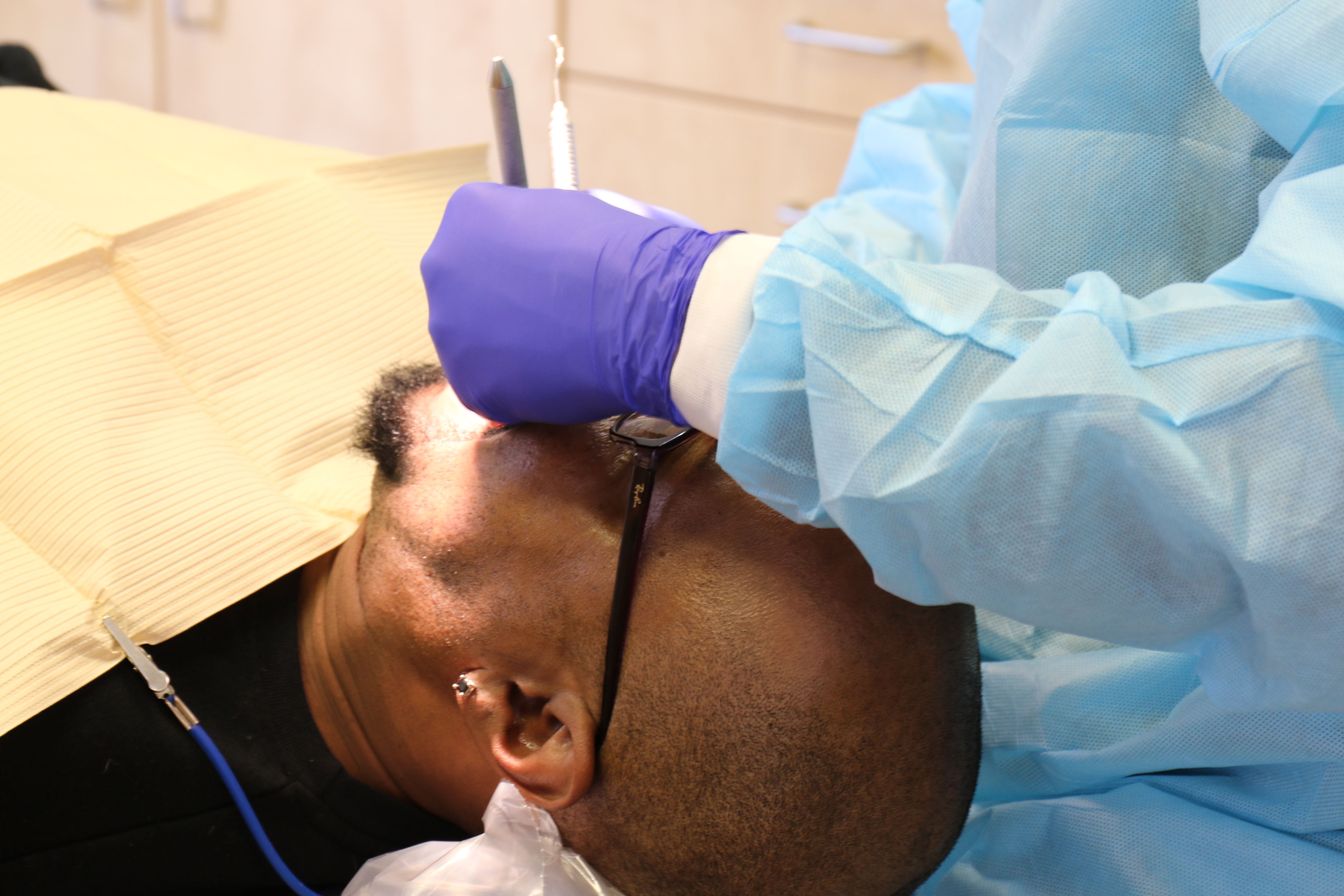 Patient receiving dental care from a provider