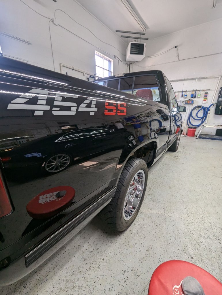 Black Chevy 454 SS truck in shop