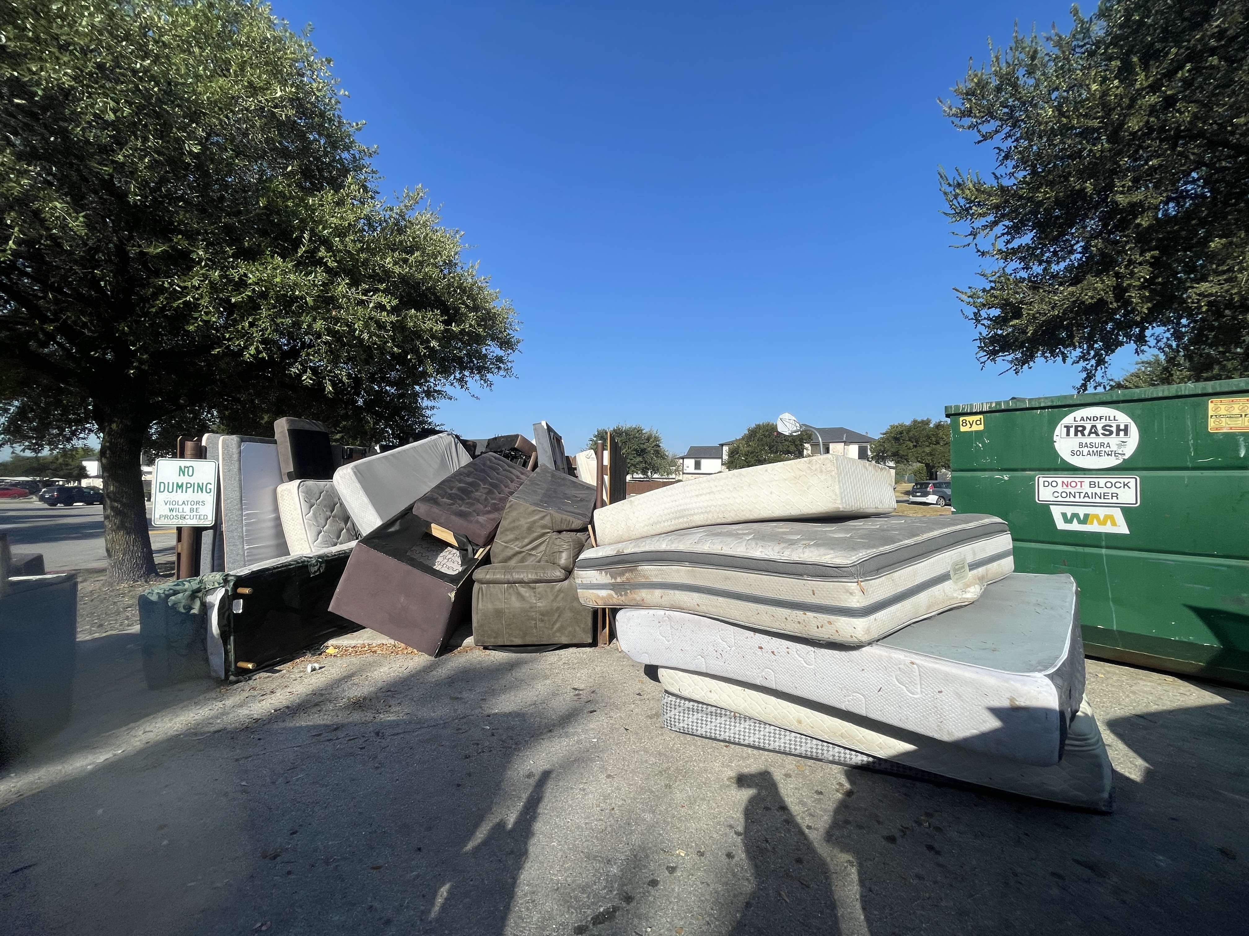 Apartment Dumpster Enclosure Cleanout before