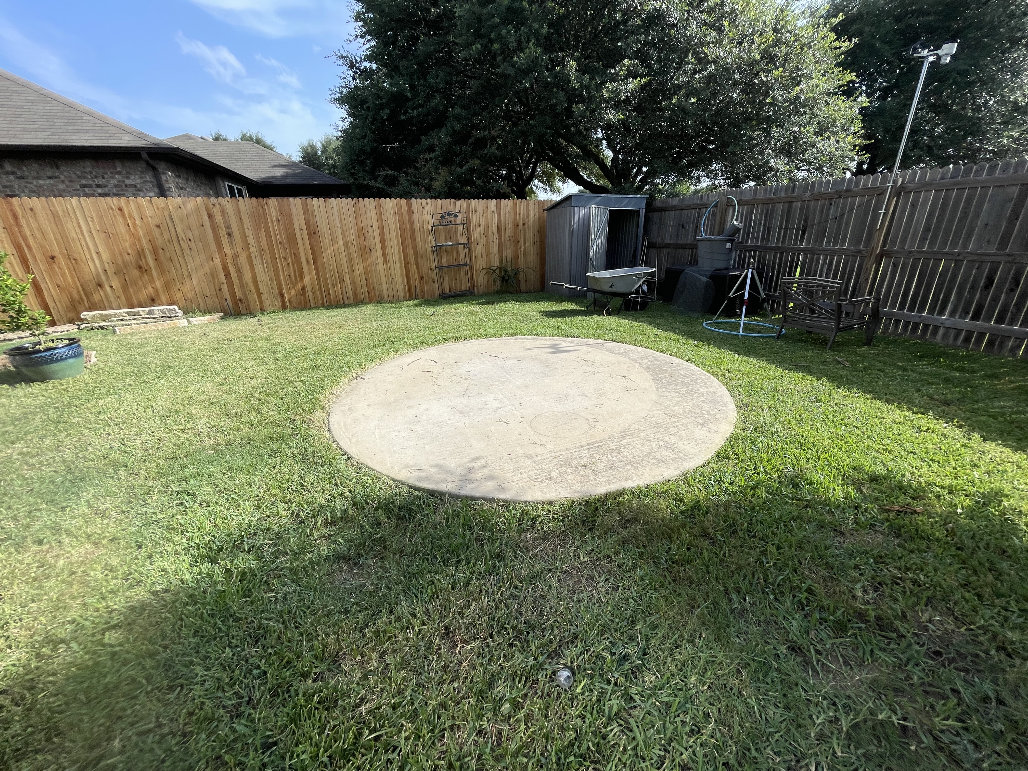 Backyard Concrete Pad & Yard Debris Cleanup