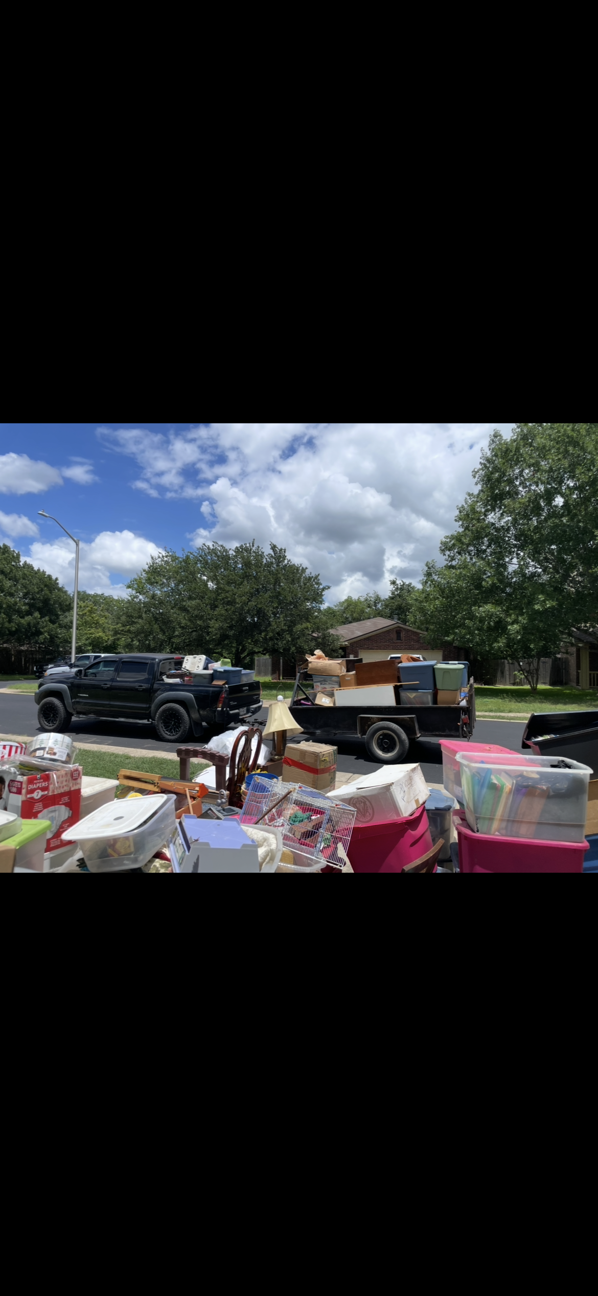 Ruben's Reliable Junk Removal Service truck on a job in Buda, Texas