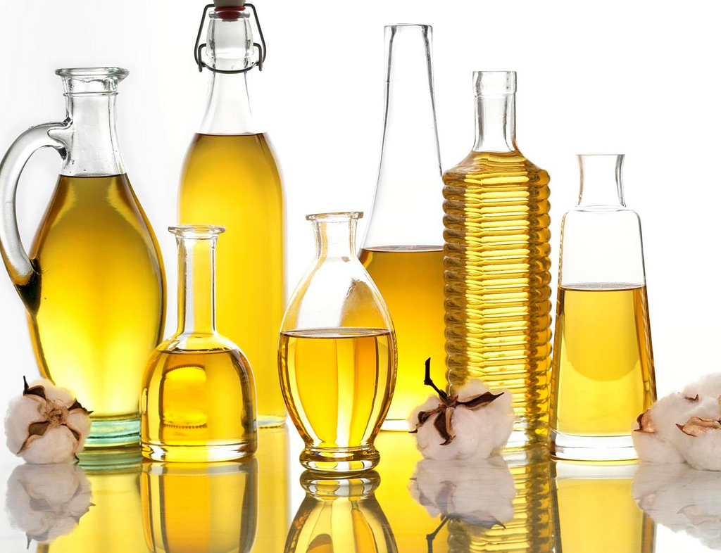 Various vegetable oils in glass bottles professional studio shot