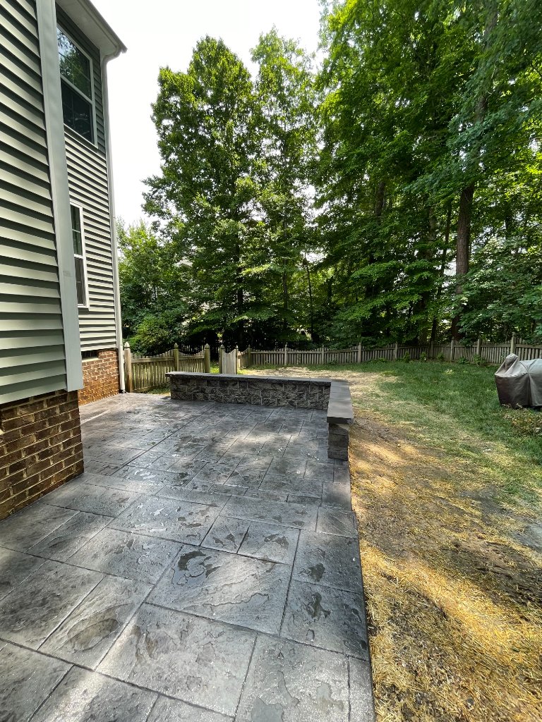 Stamped concrete patio with seating wall