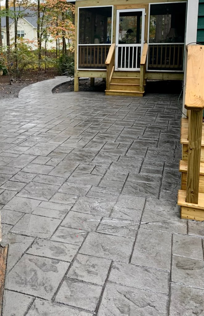 Stamped concrete patio with screened porch