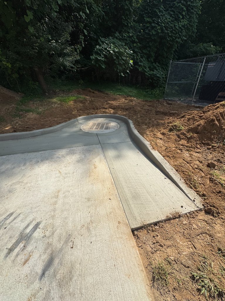 Concrete driveway with drainage basin