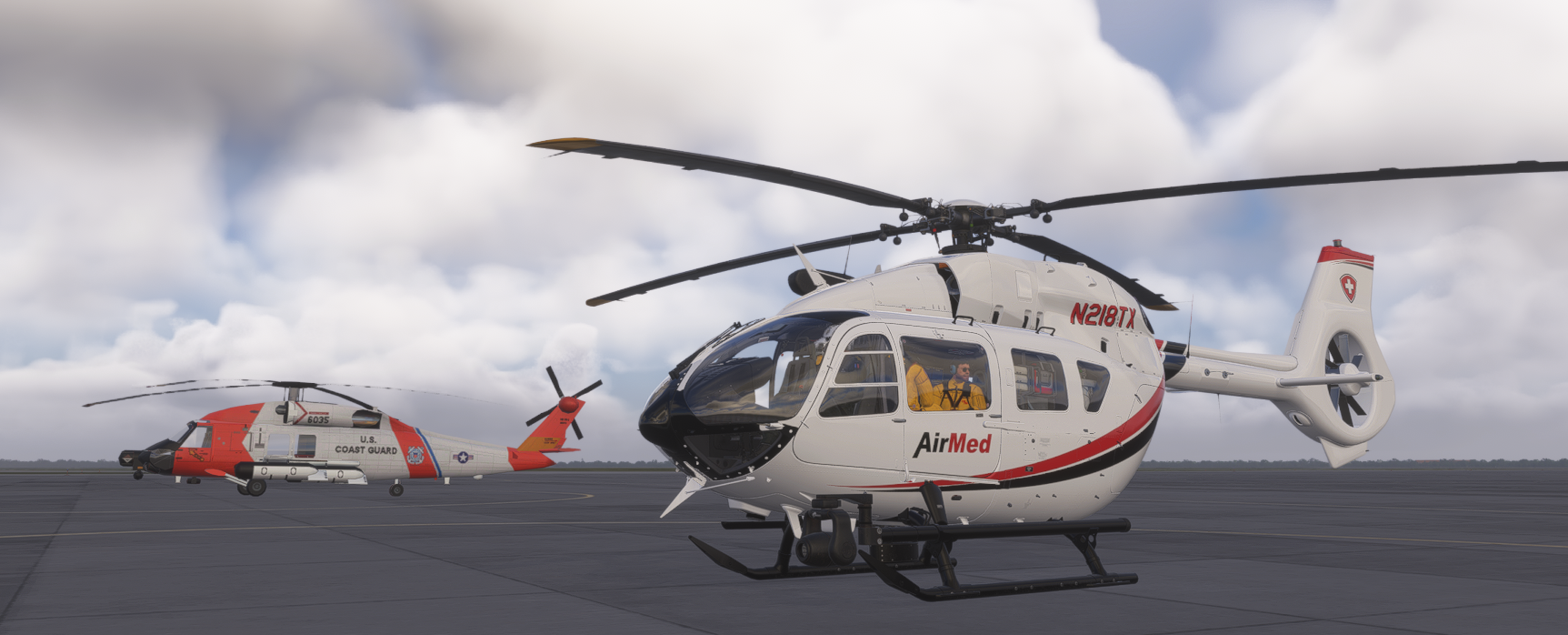AirMed helicopter (N218TX) parked beside a US Coast Guard helicopter