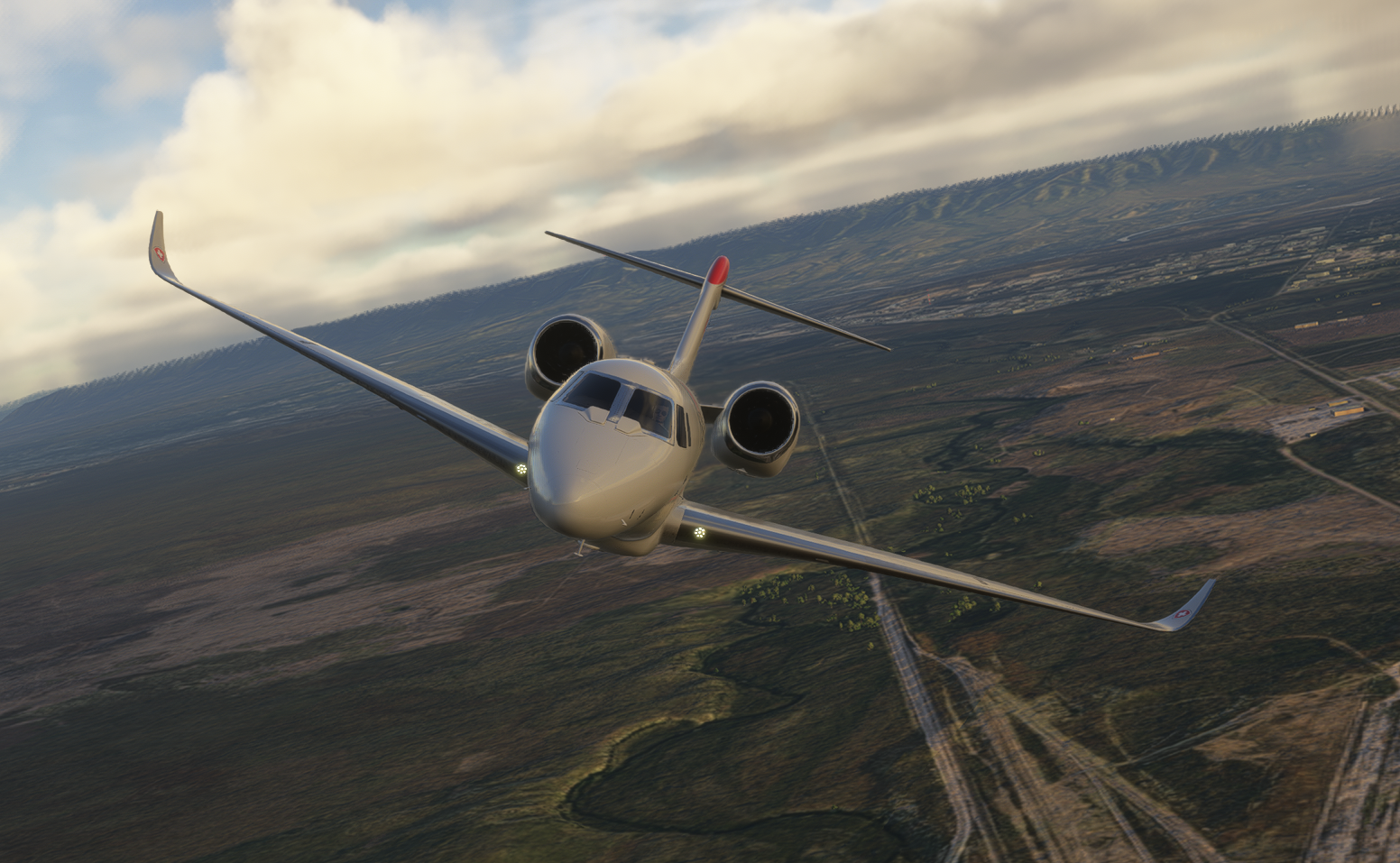 AirMed executive jet in head-on flight during golden hour sunset