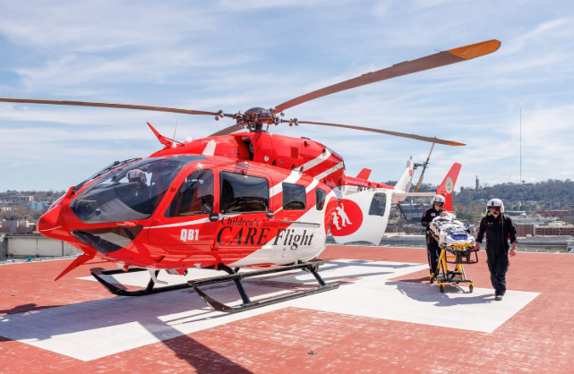 Children's CARE Flight medical helicopter (QB1) on a rooftop hospital helipad